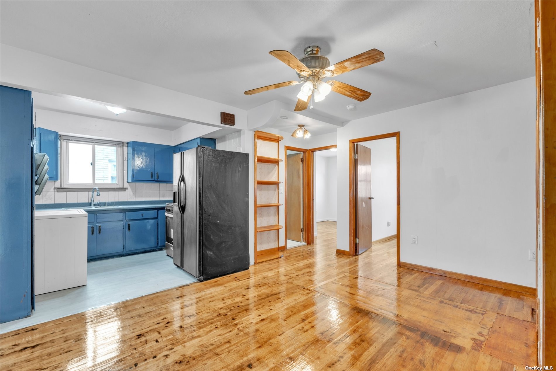 a view of a kitchen with a sink and a window