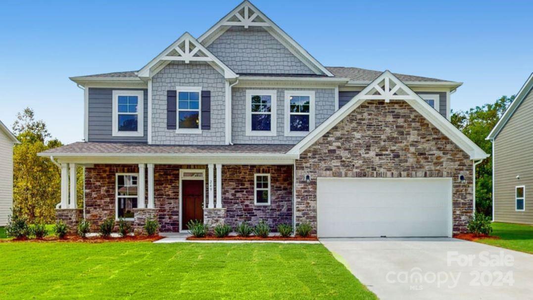 front view of a house with a yard