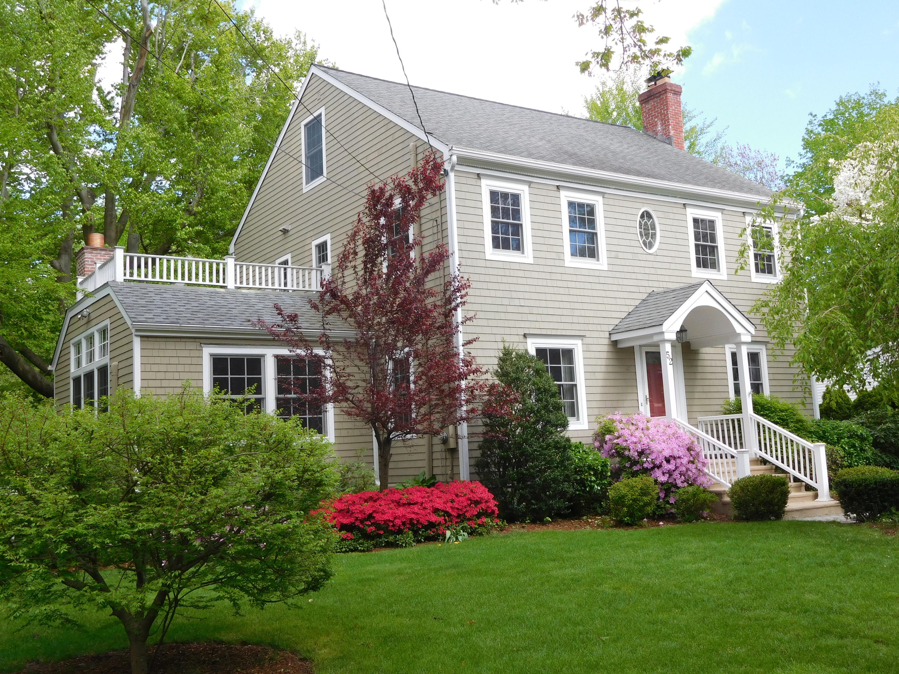 a front view of a house with garden