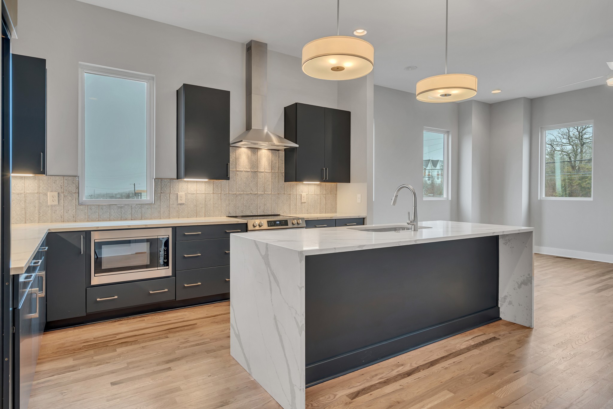 a kitchen with a stove and a sink