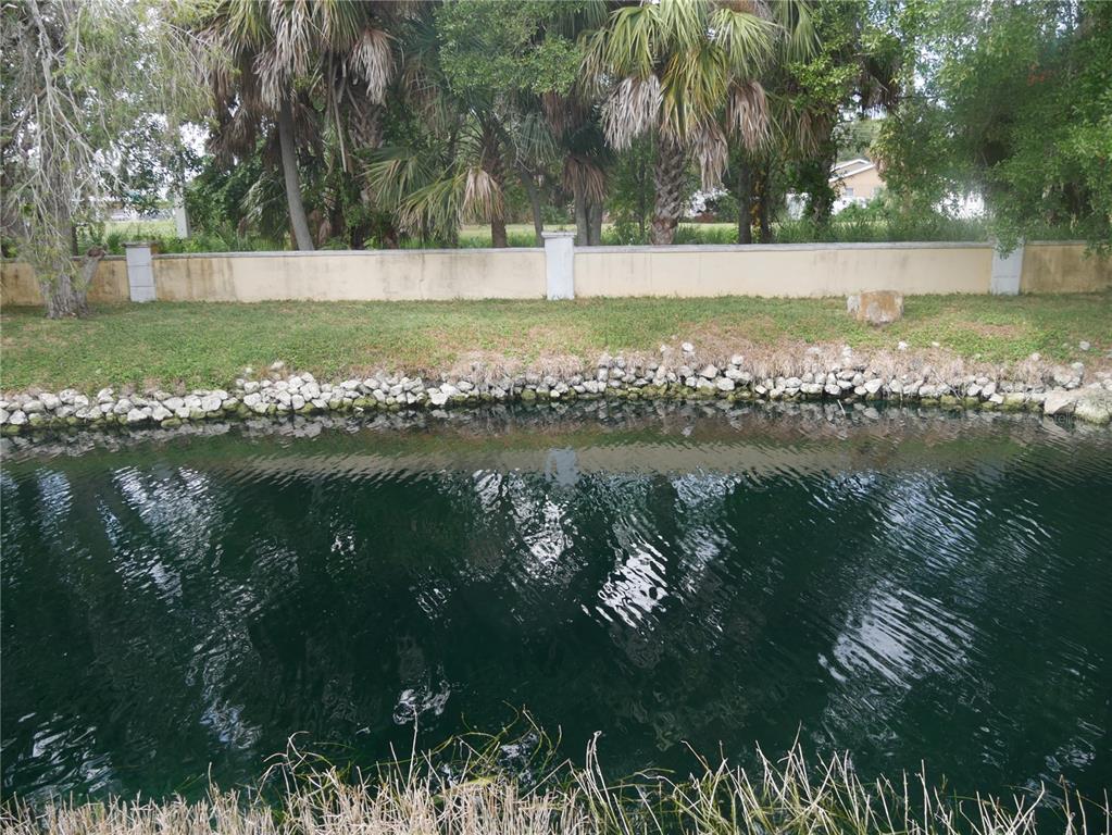 a view of a lake with a yard