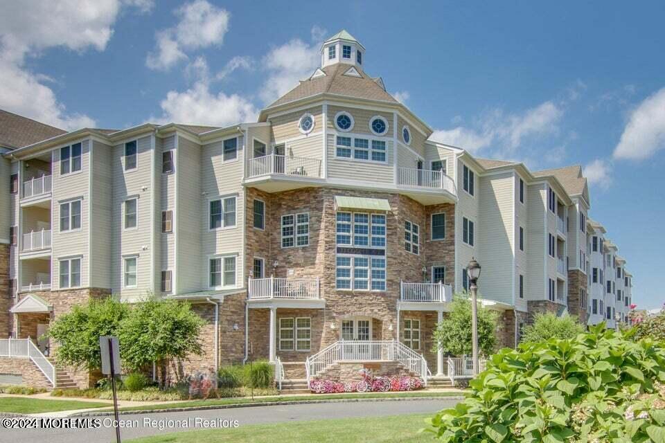 a front view of a building with a yard