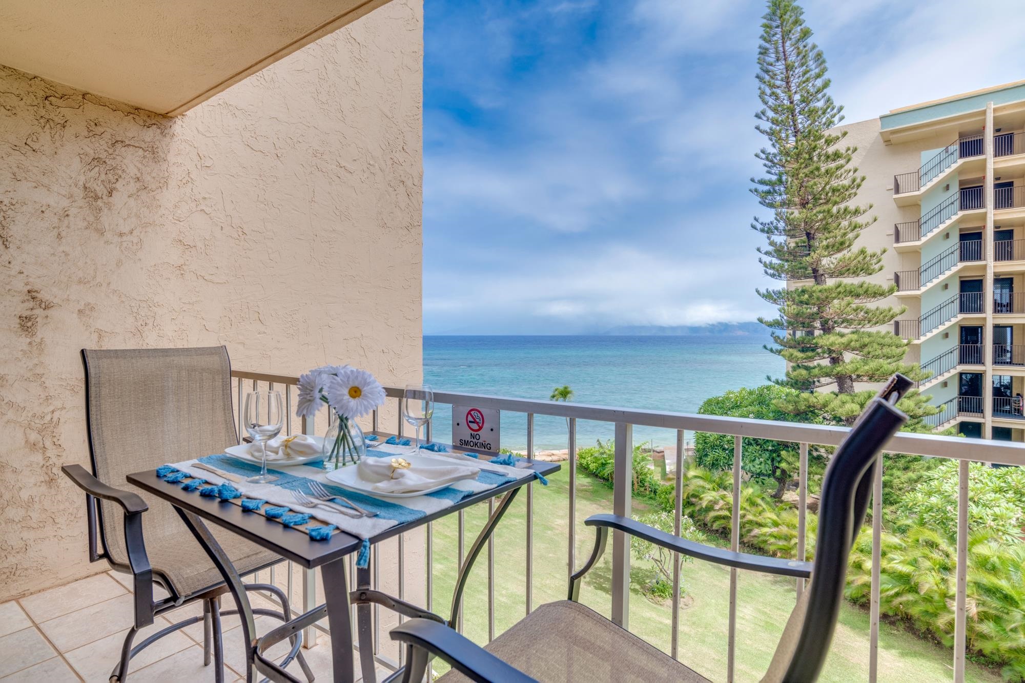 a view of a balcony with furniture