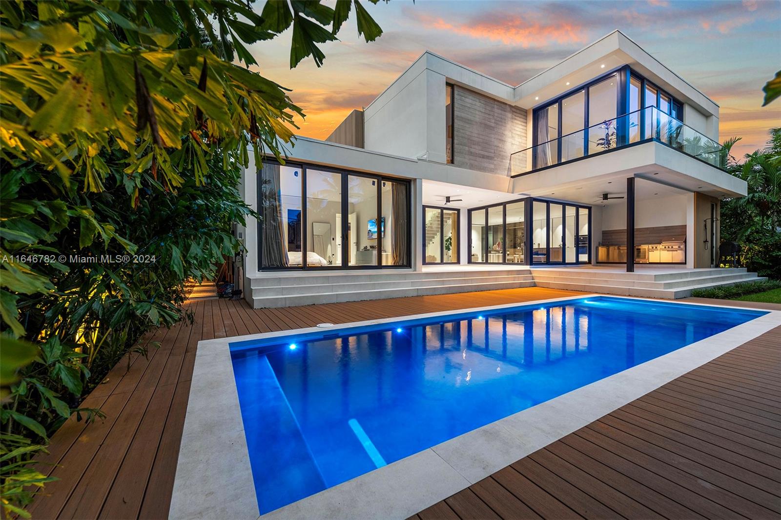 a view of a house with pool and wooden floor