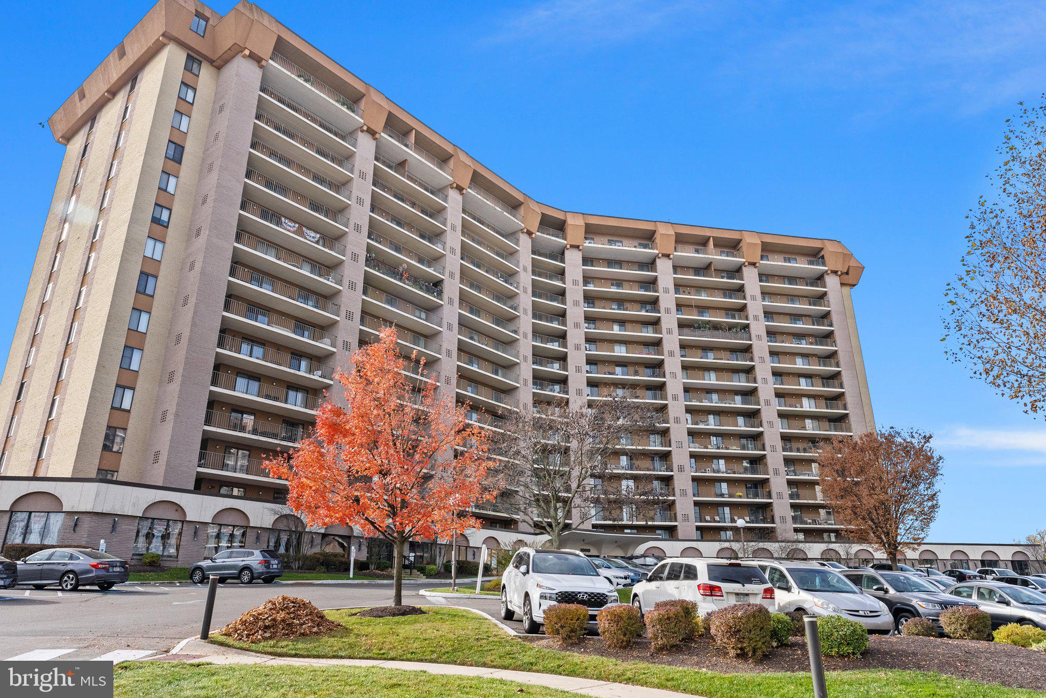 a front view of a building with a yard