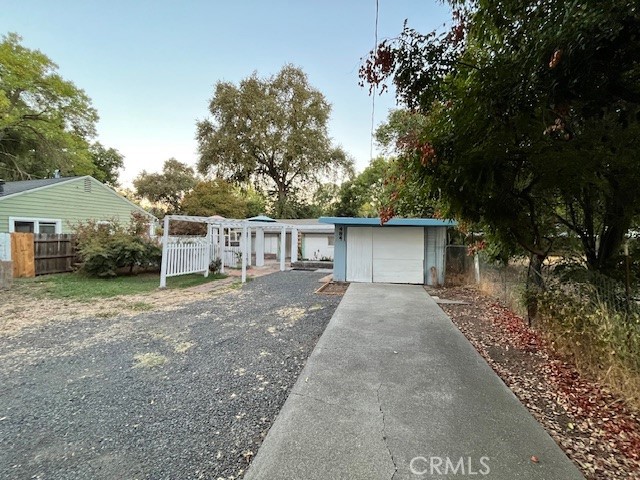 a view of a house with a yard and garage