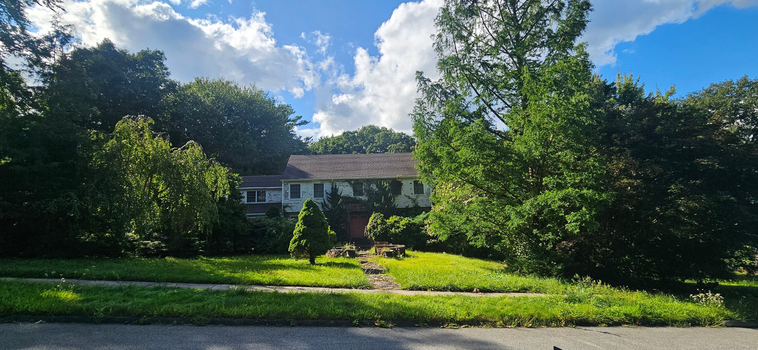 a front view of a house with a yard