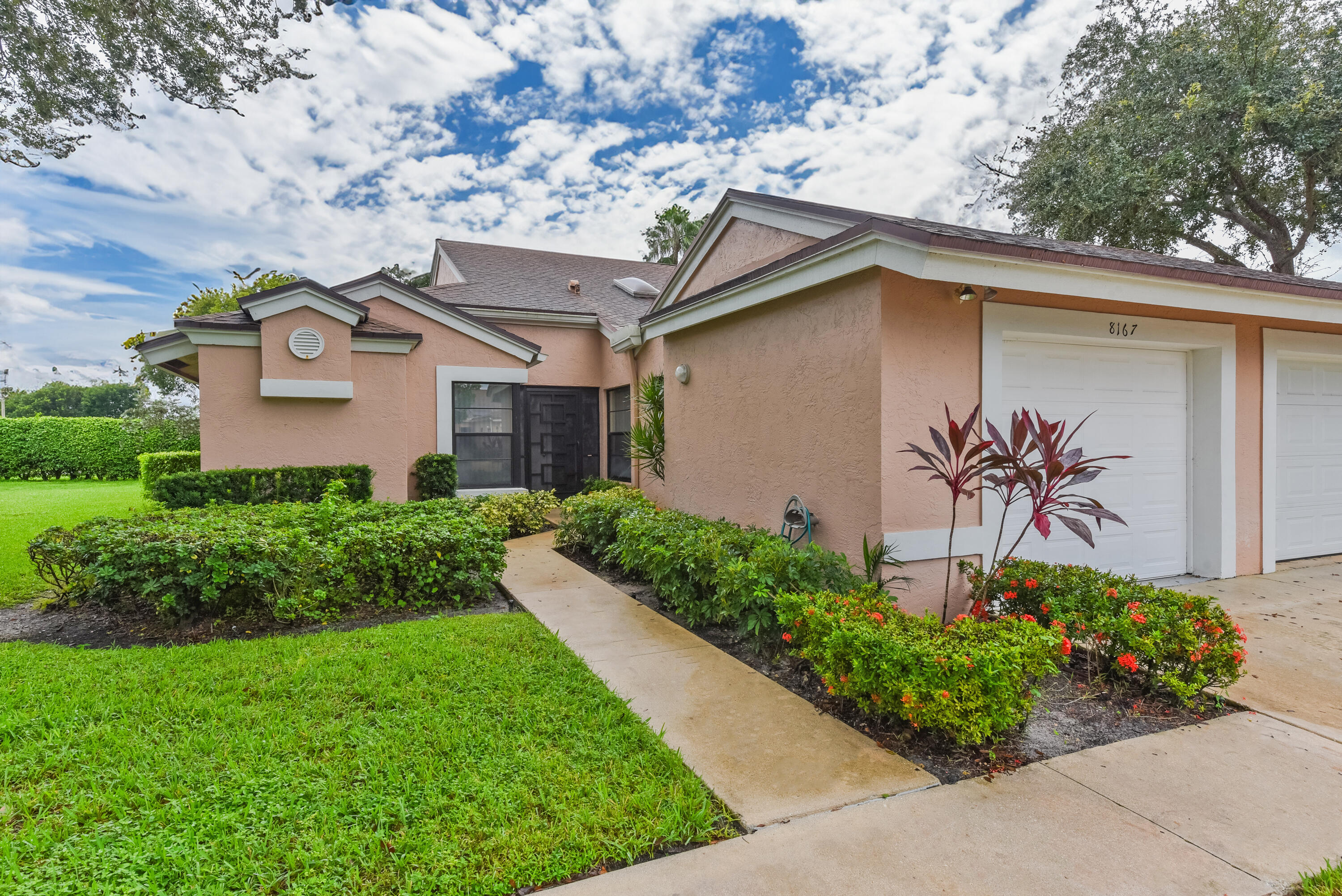 a front view of a house with a yard