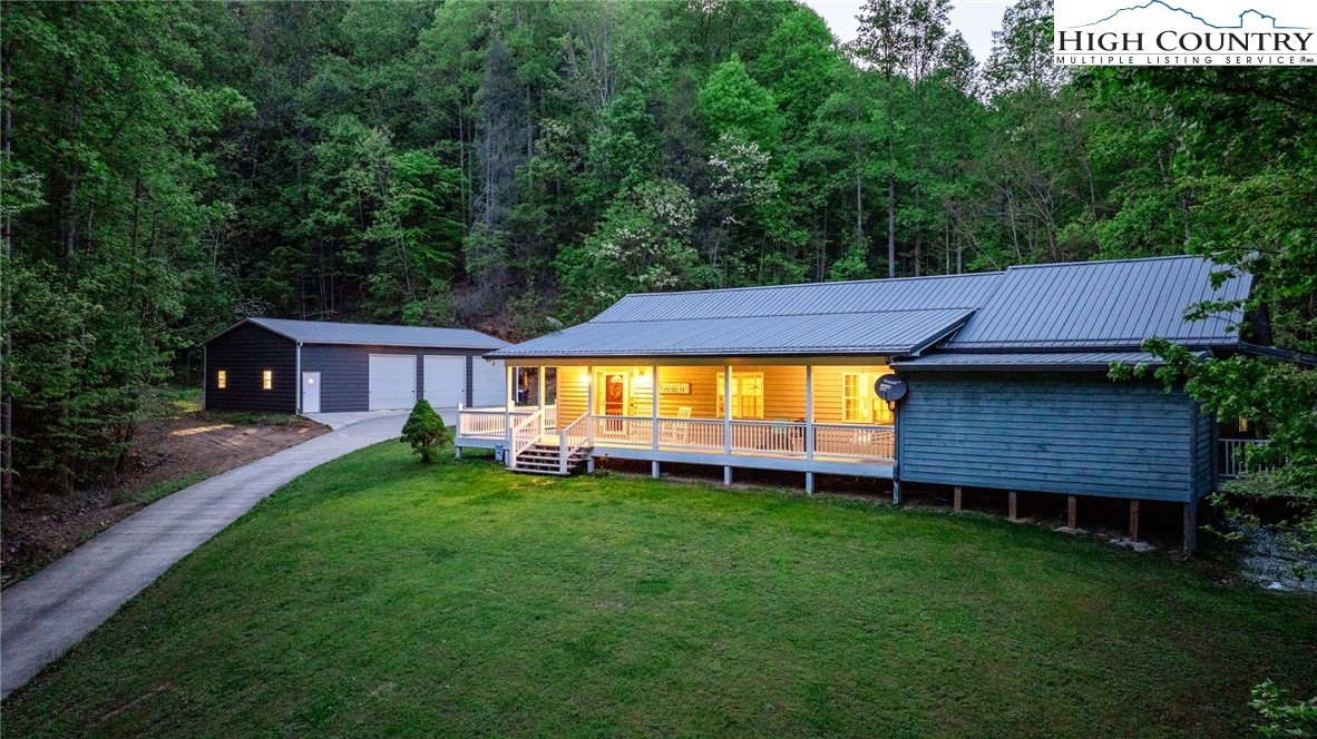 a view of a house with a yard porch and sitting area