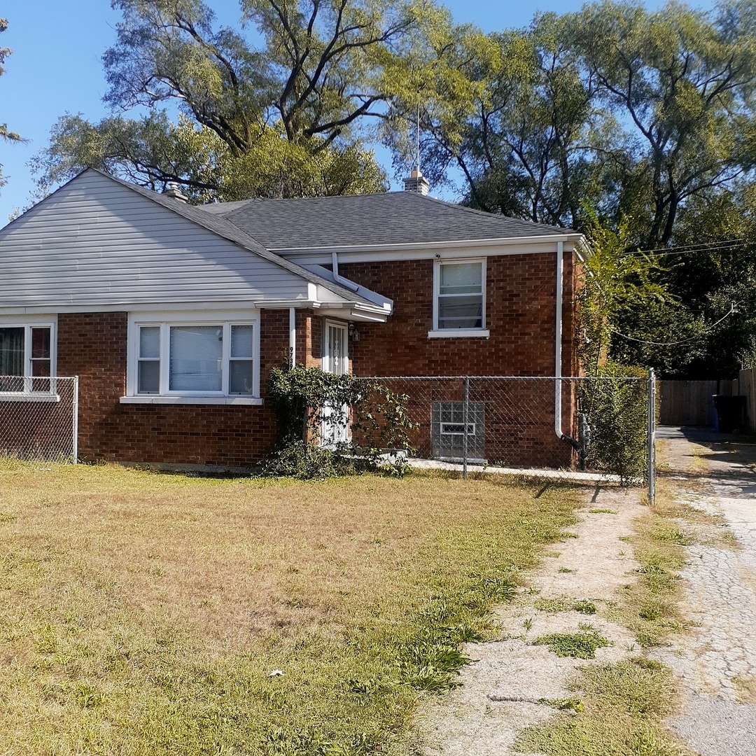 a front view of a house with yard