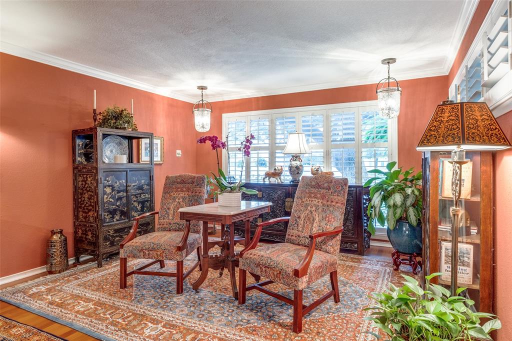 a dining room with furniture window and outdoor view