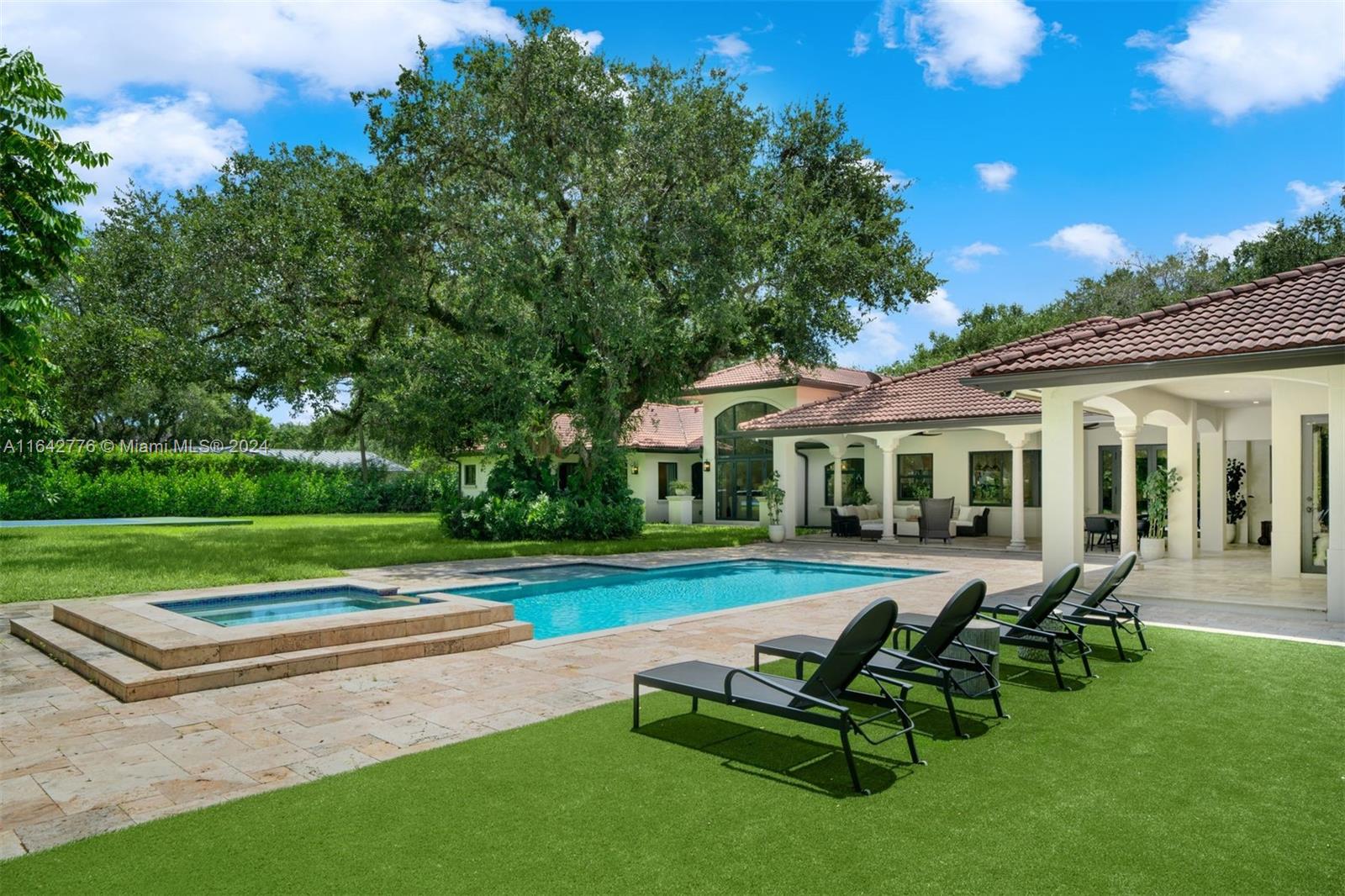 a view of a house with a yard patio and a patio