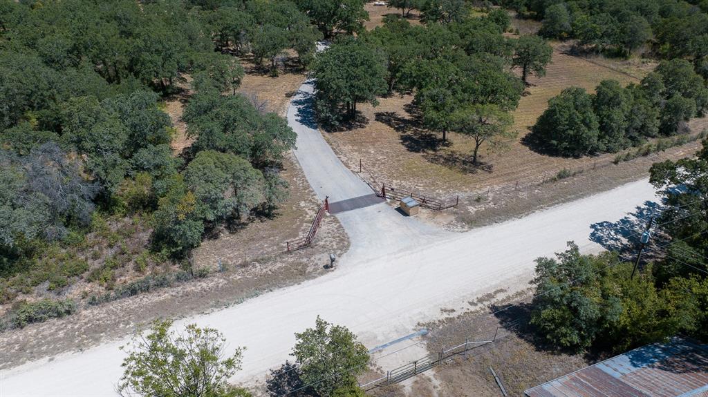 an aerial view of a backyard of a house