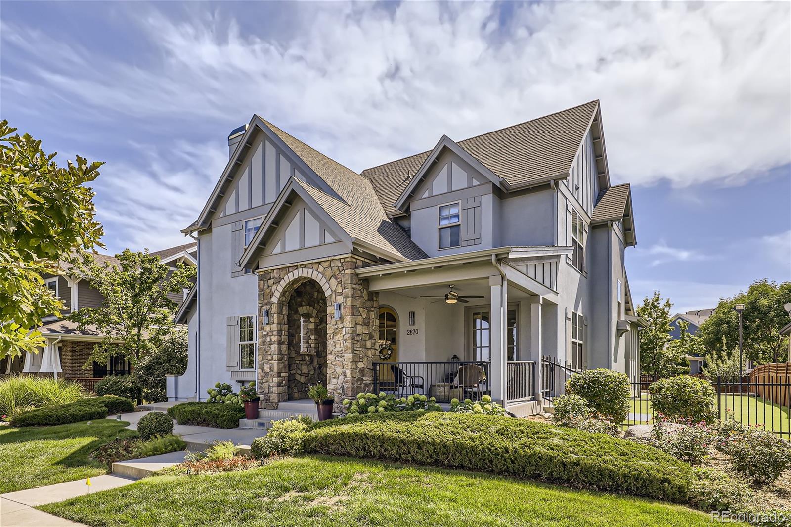 a front view of a house with garden