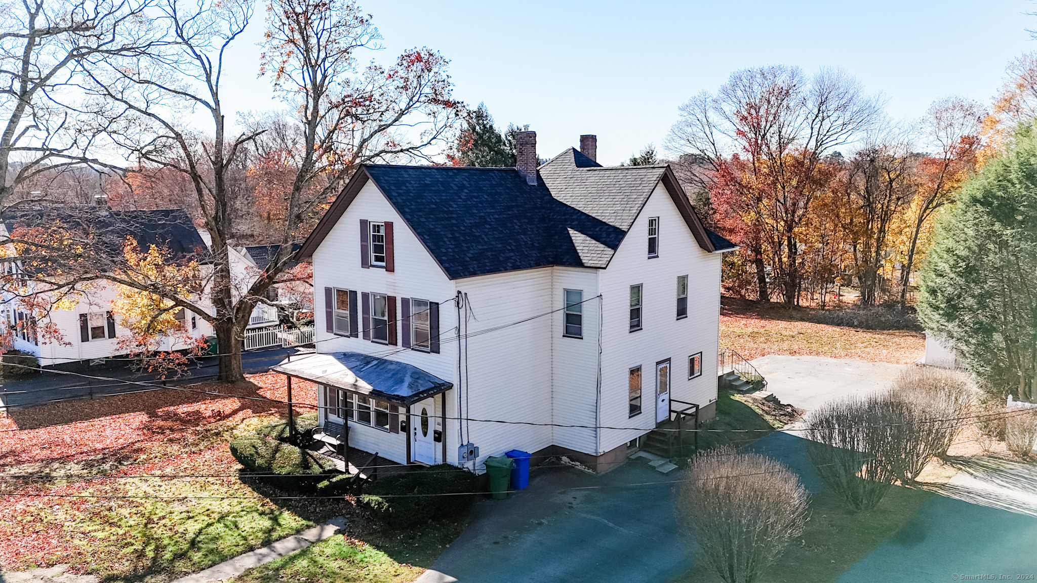 a view of a house with a yard covered with snow