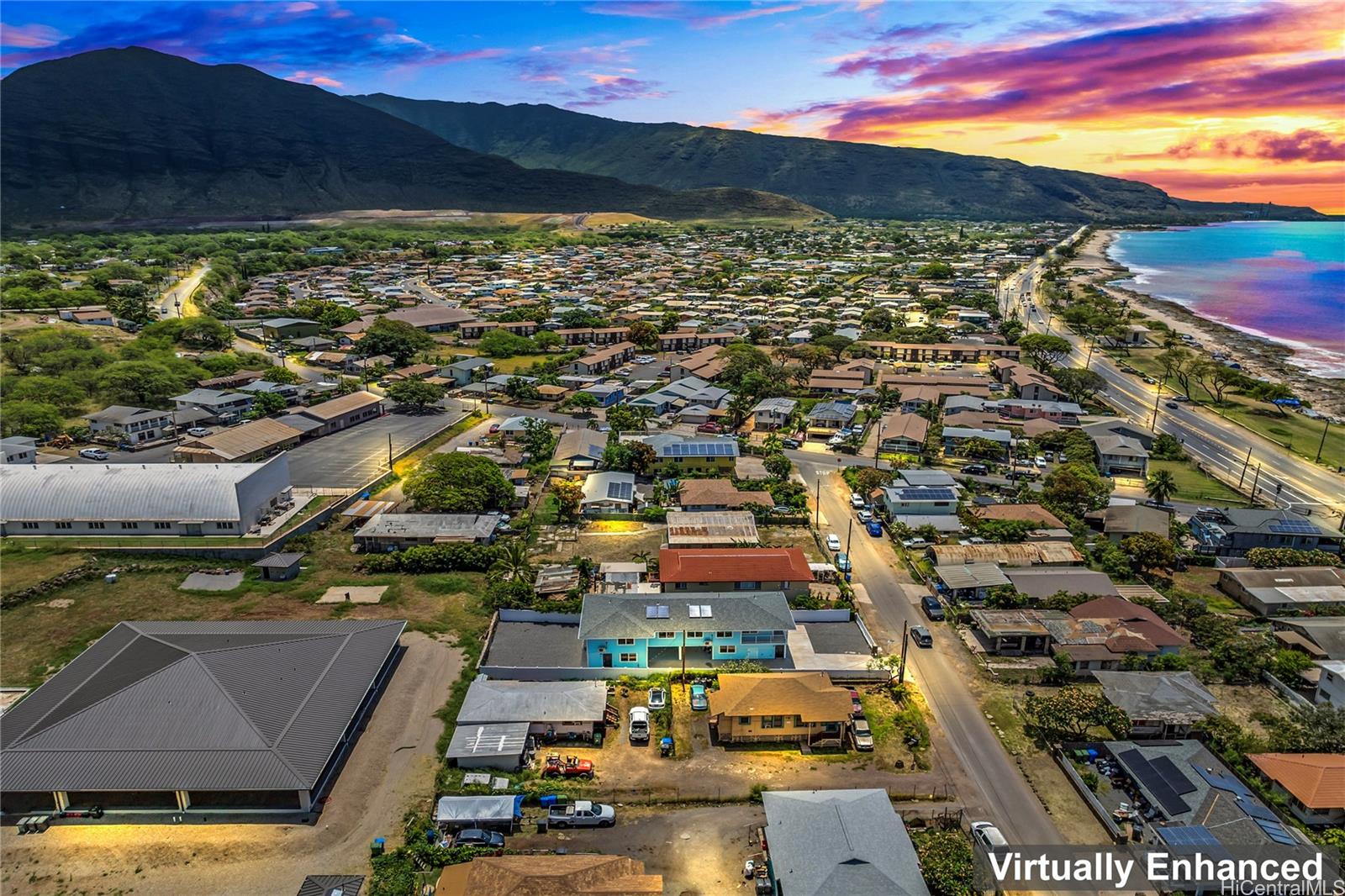 an aerial view of residential houses with outdoor space