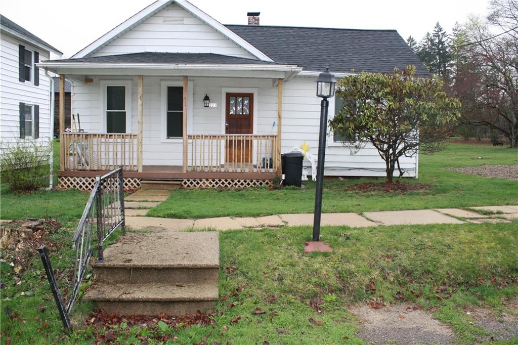 a house that has a garden in front of it