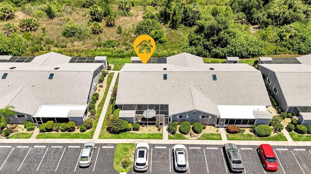 an aerial view of residential house with outdoor space and swimming pool