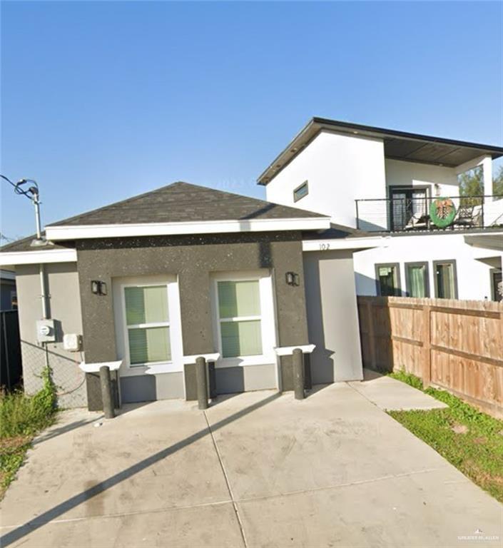 Rear view of house with a balcony