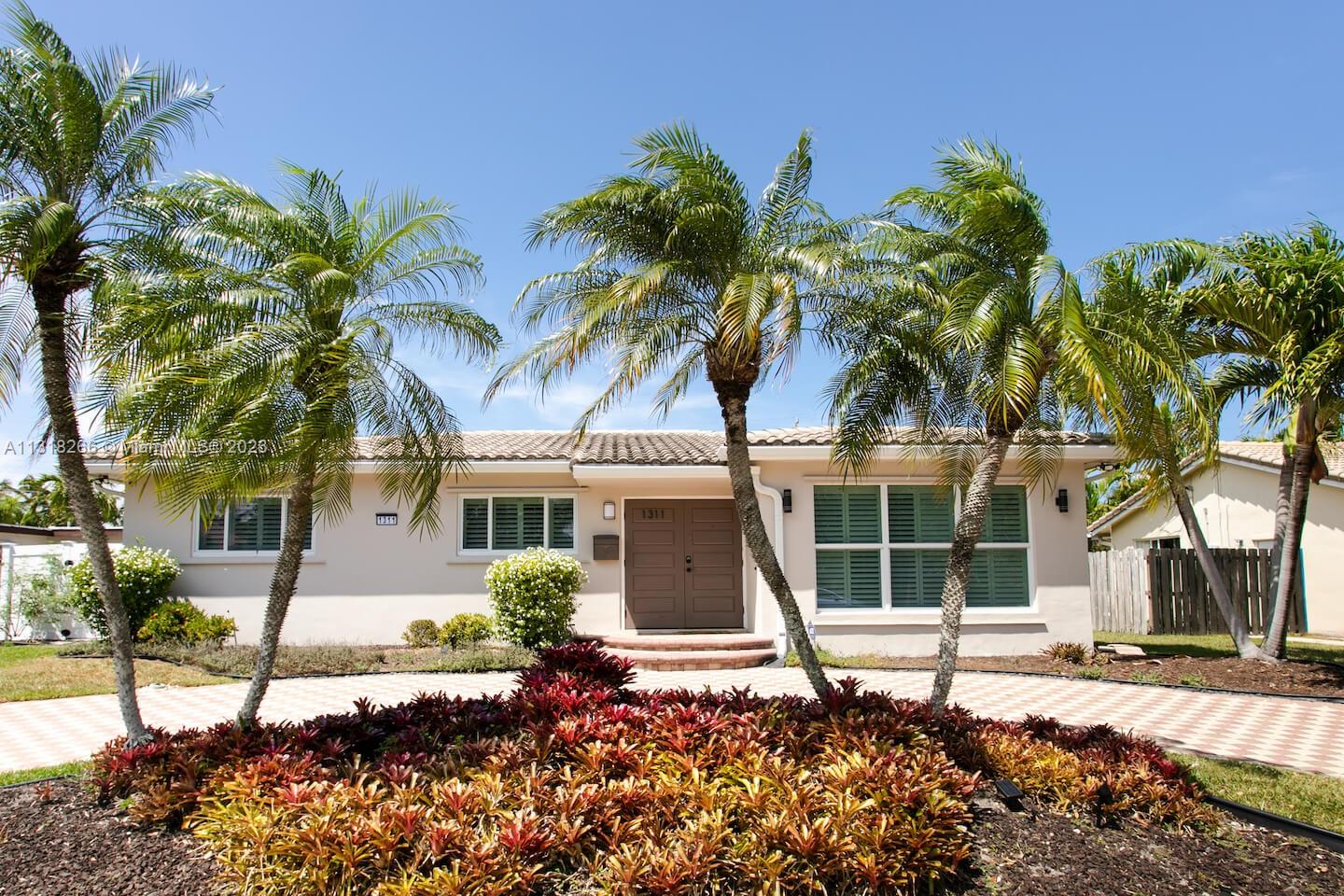 front view of a house with a garden