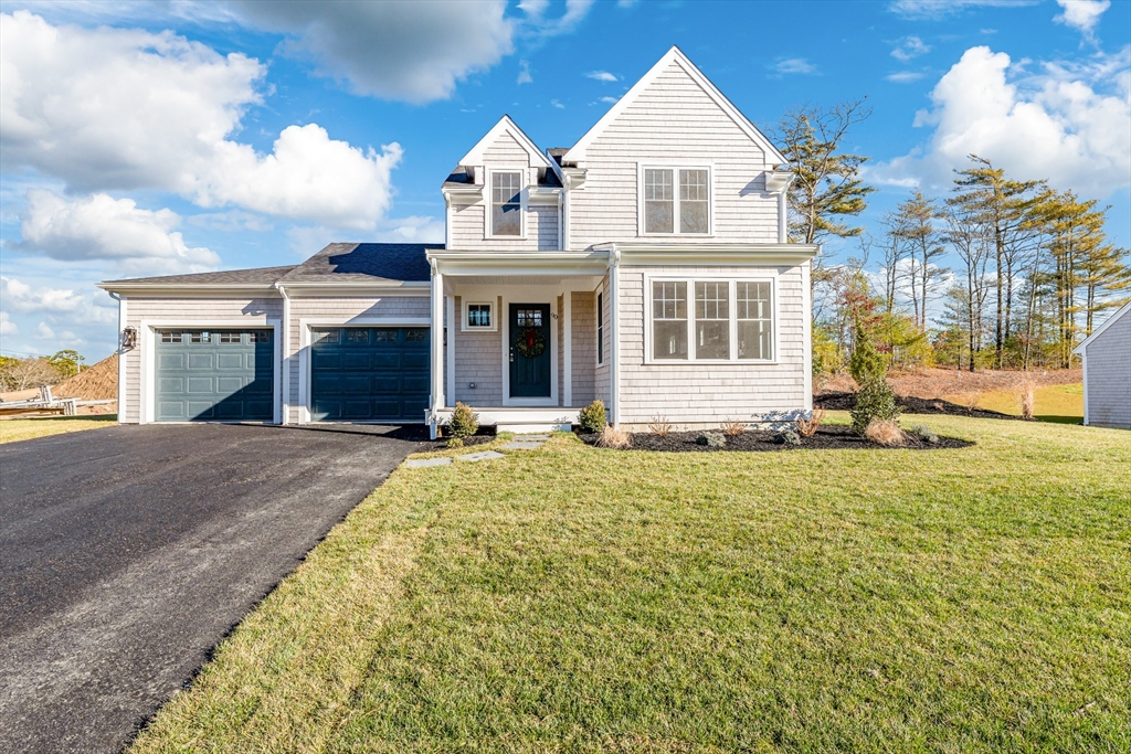 a view of house with yard and entertaining space