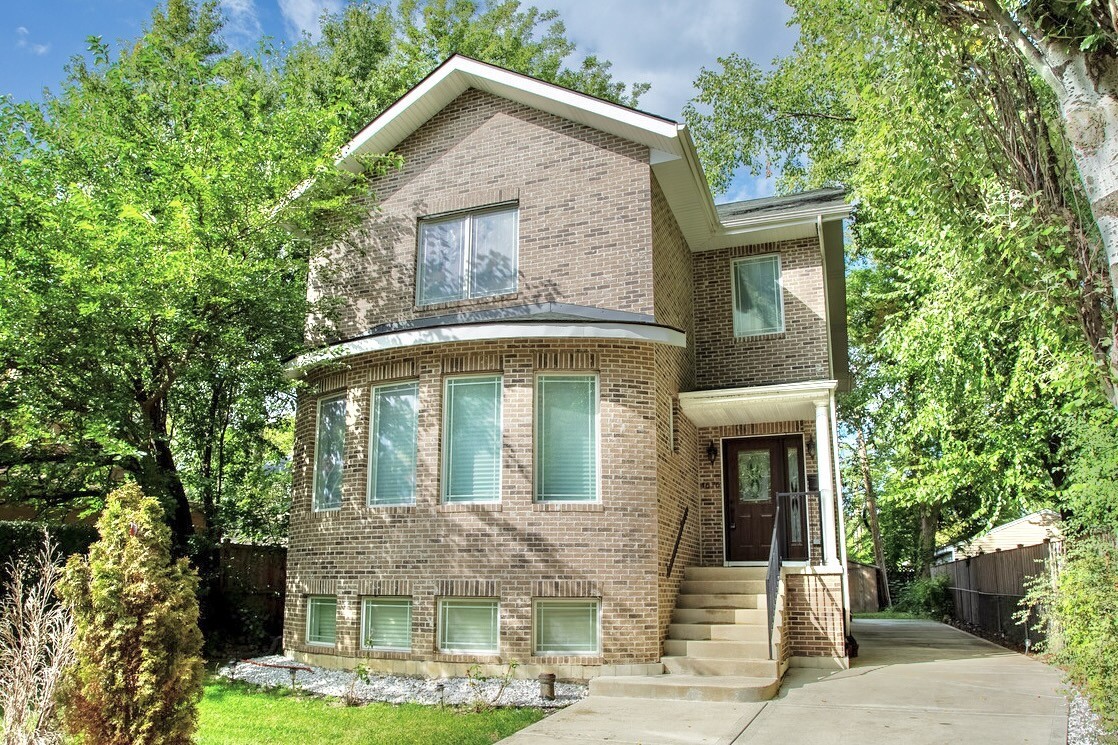 a front view of a house with garden