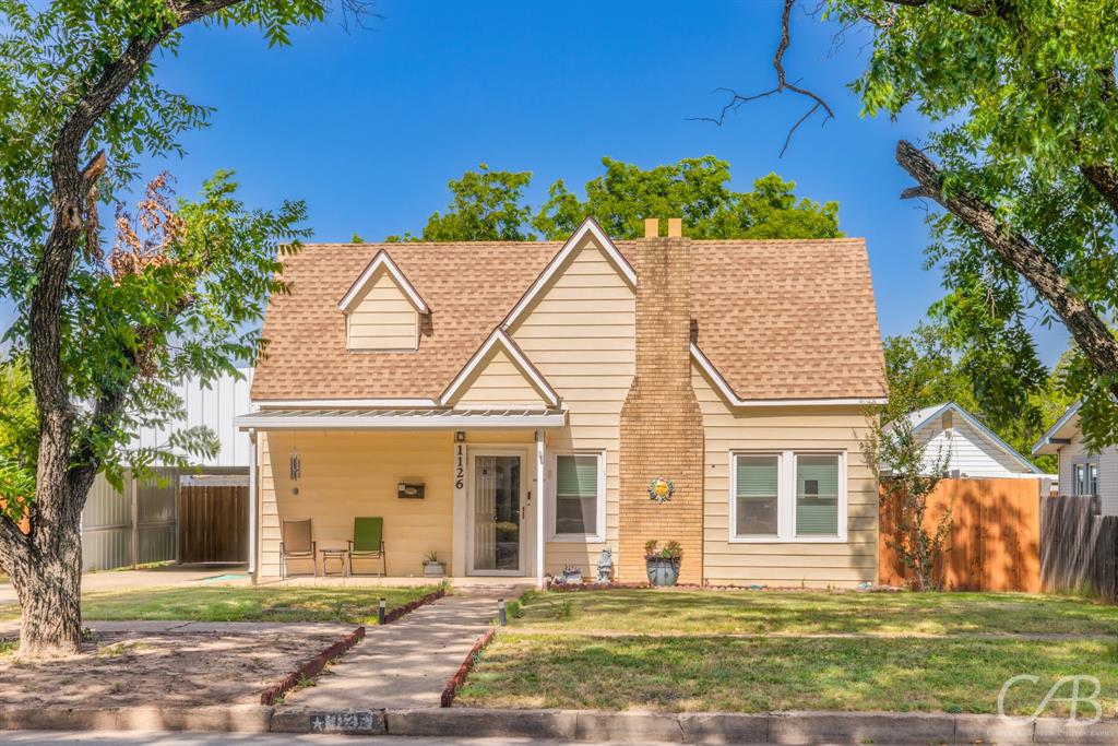 front view of a house with a yard