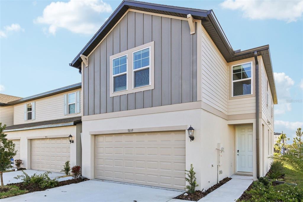 a front view of a house with a garage