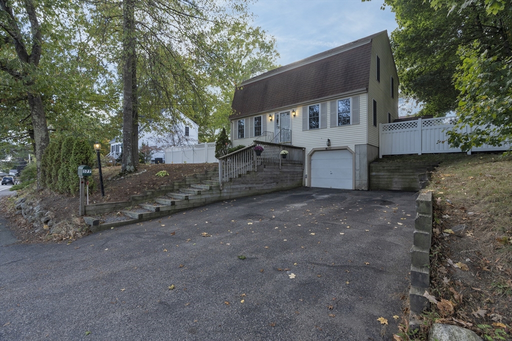 a view of a house with a back yard