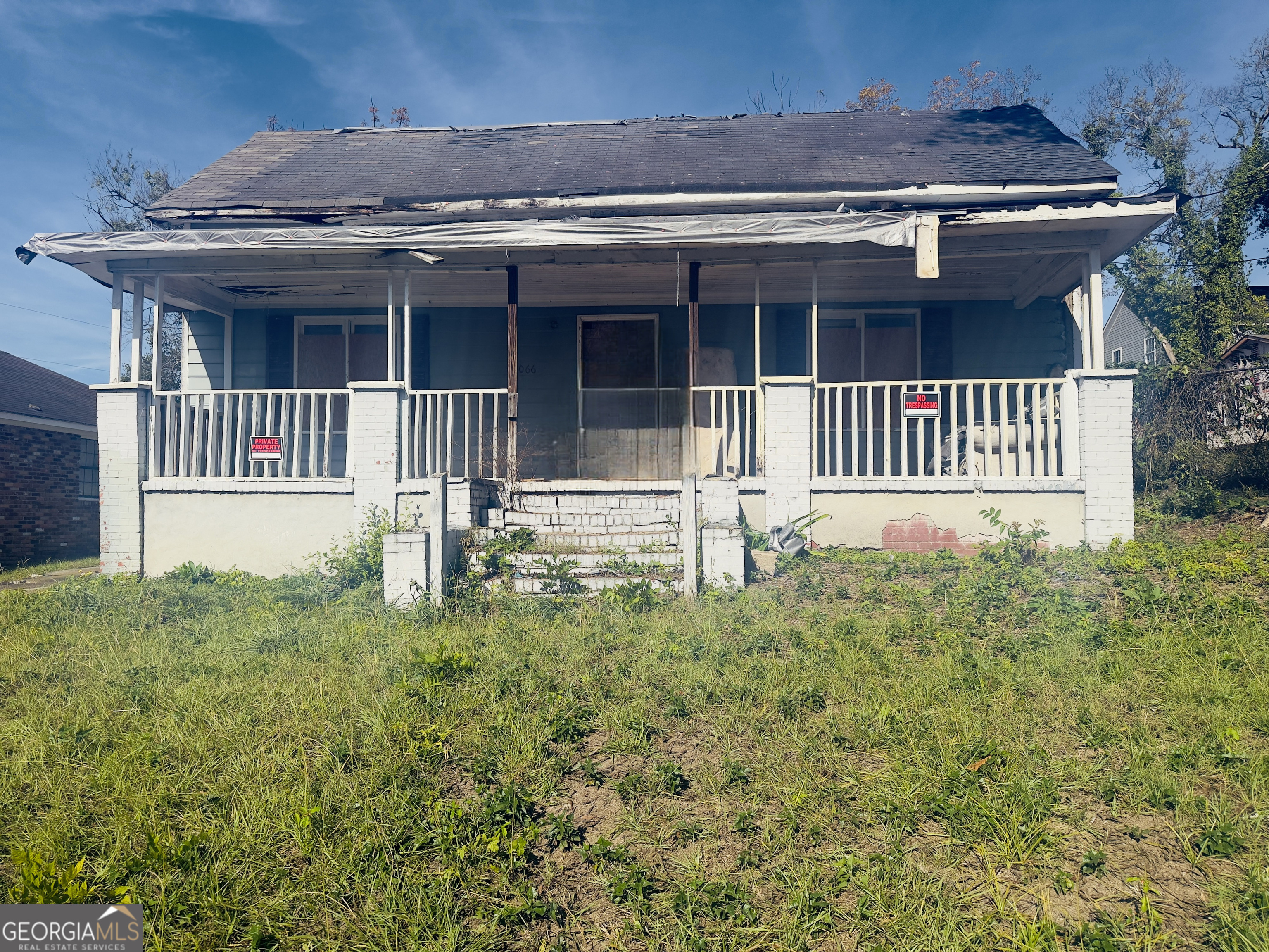 a front view of a house with a porch