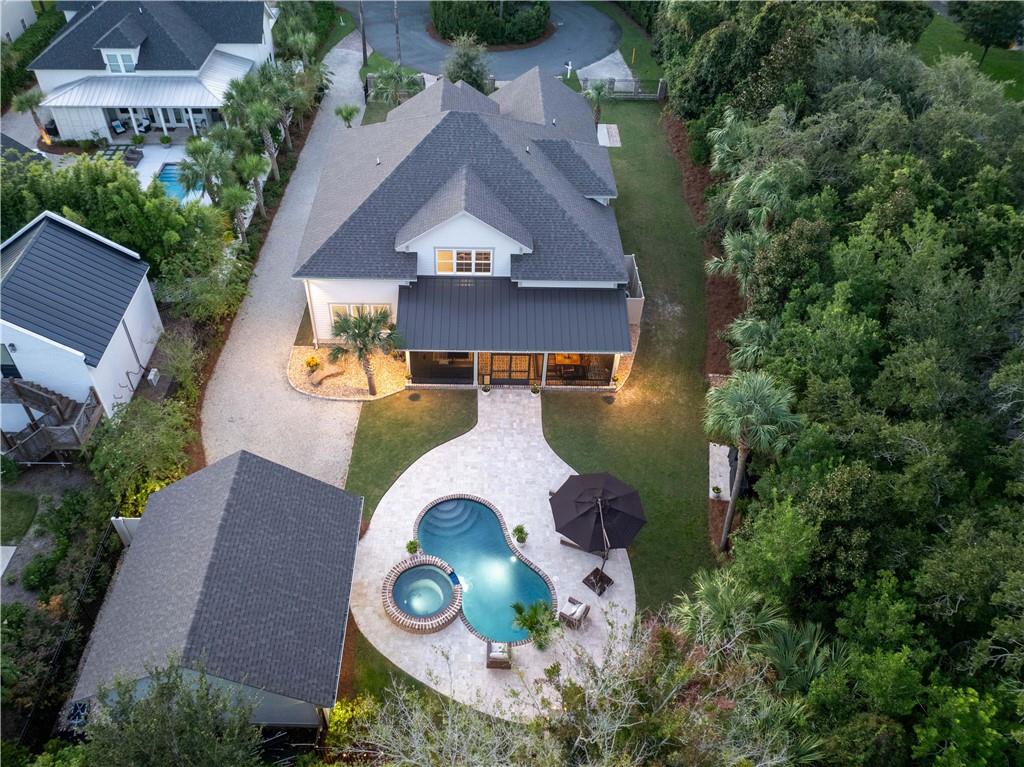 an aerial view of a house with garden space and street view