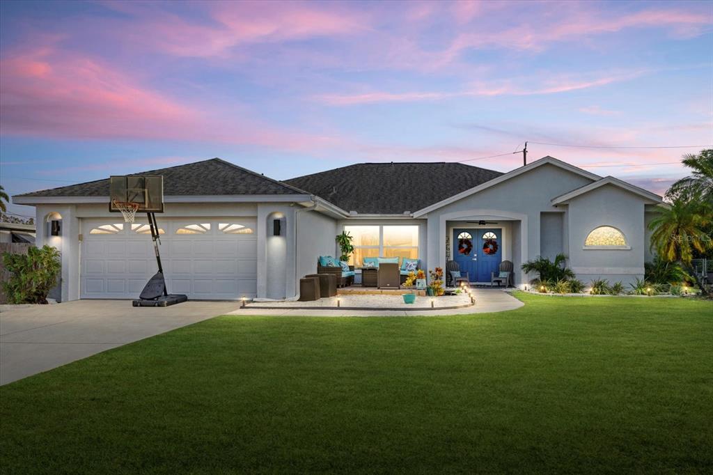 a front view of a house with patio and yard