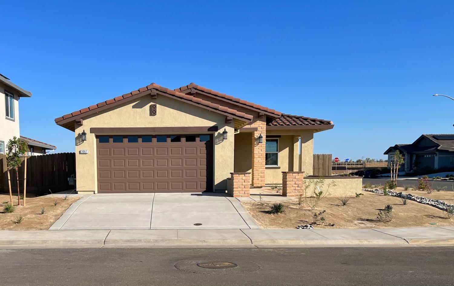 a front view of a house with yard