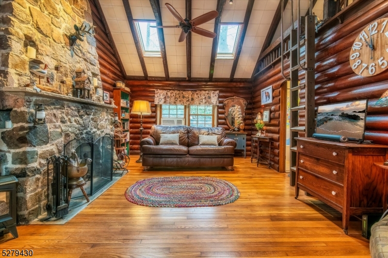 a living room with patio furniture and a fireplace