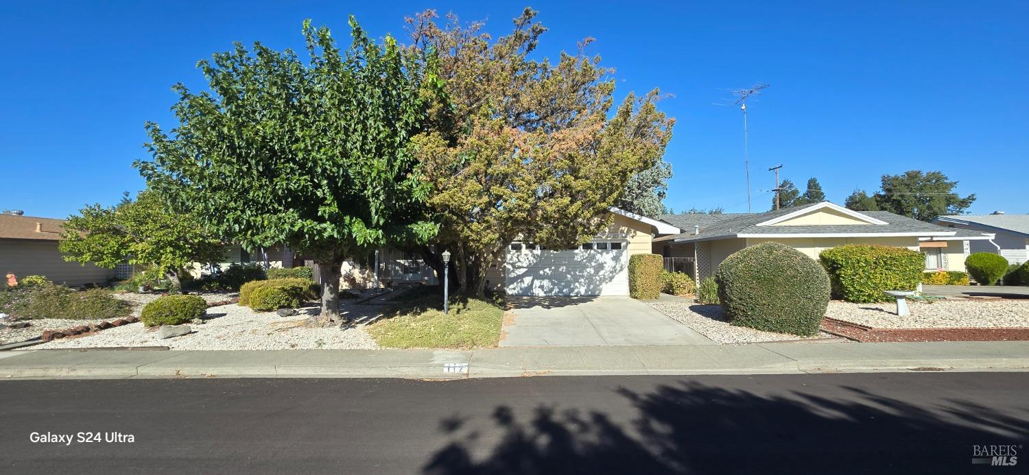 a view of a house with a yard