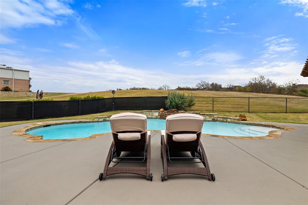 a view of a patio with swimming pool