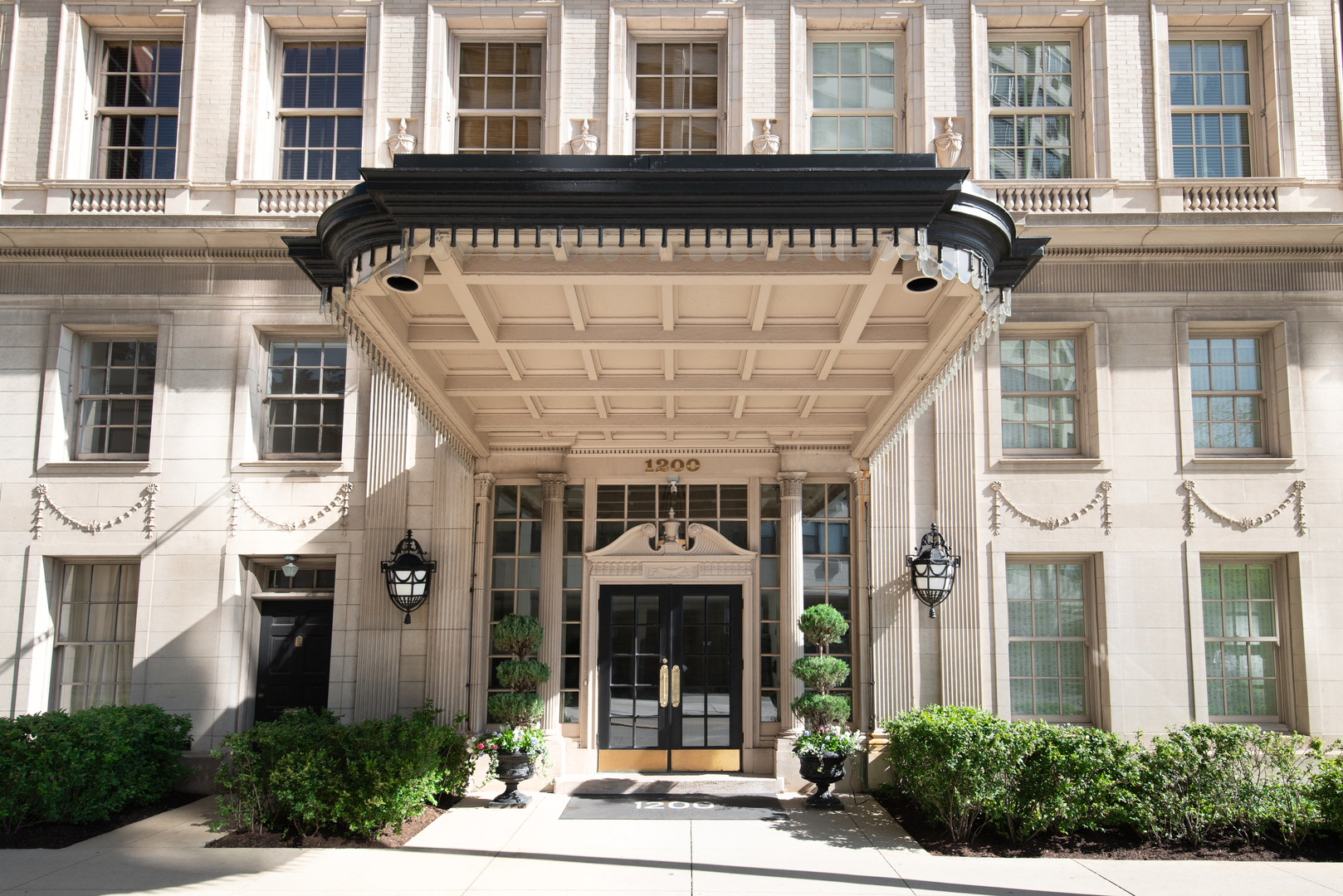 a front view of a building with a porch