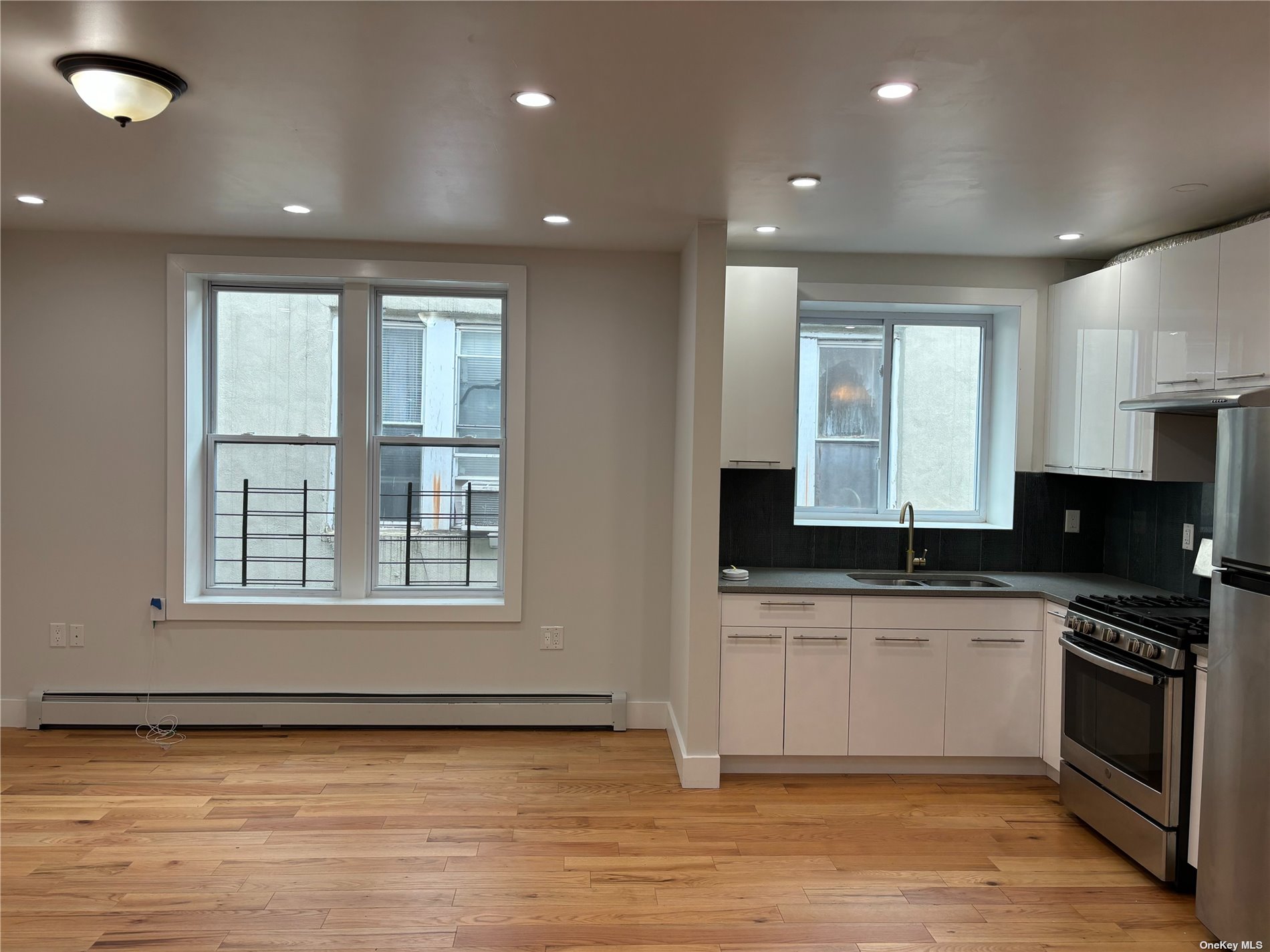 a kitchen with granite countertop a stove and a sink