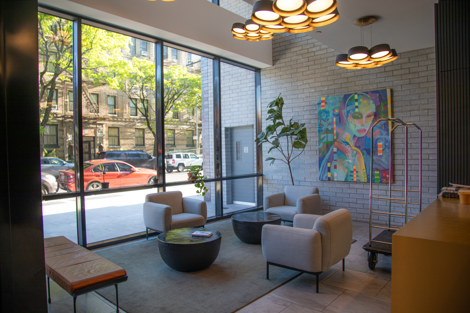 a living room with furniture and a floor to ceiling window