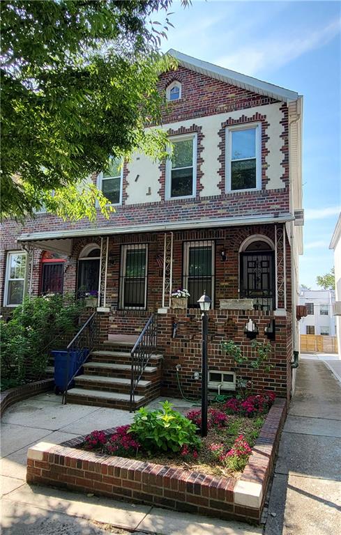 front view of a house with a small yard