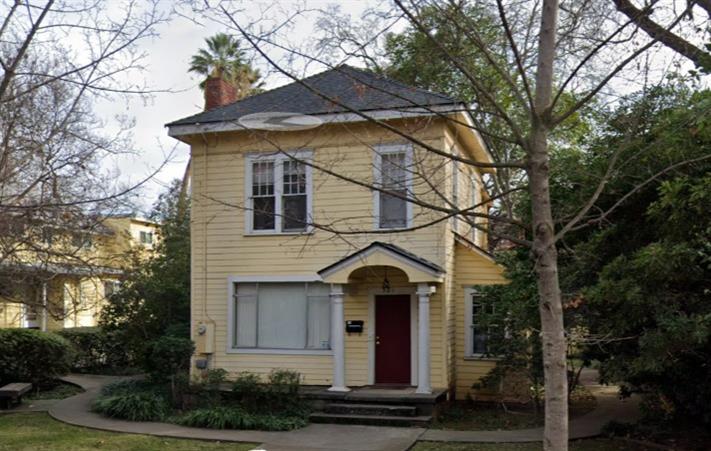 a front view of a house with yard