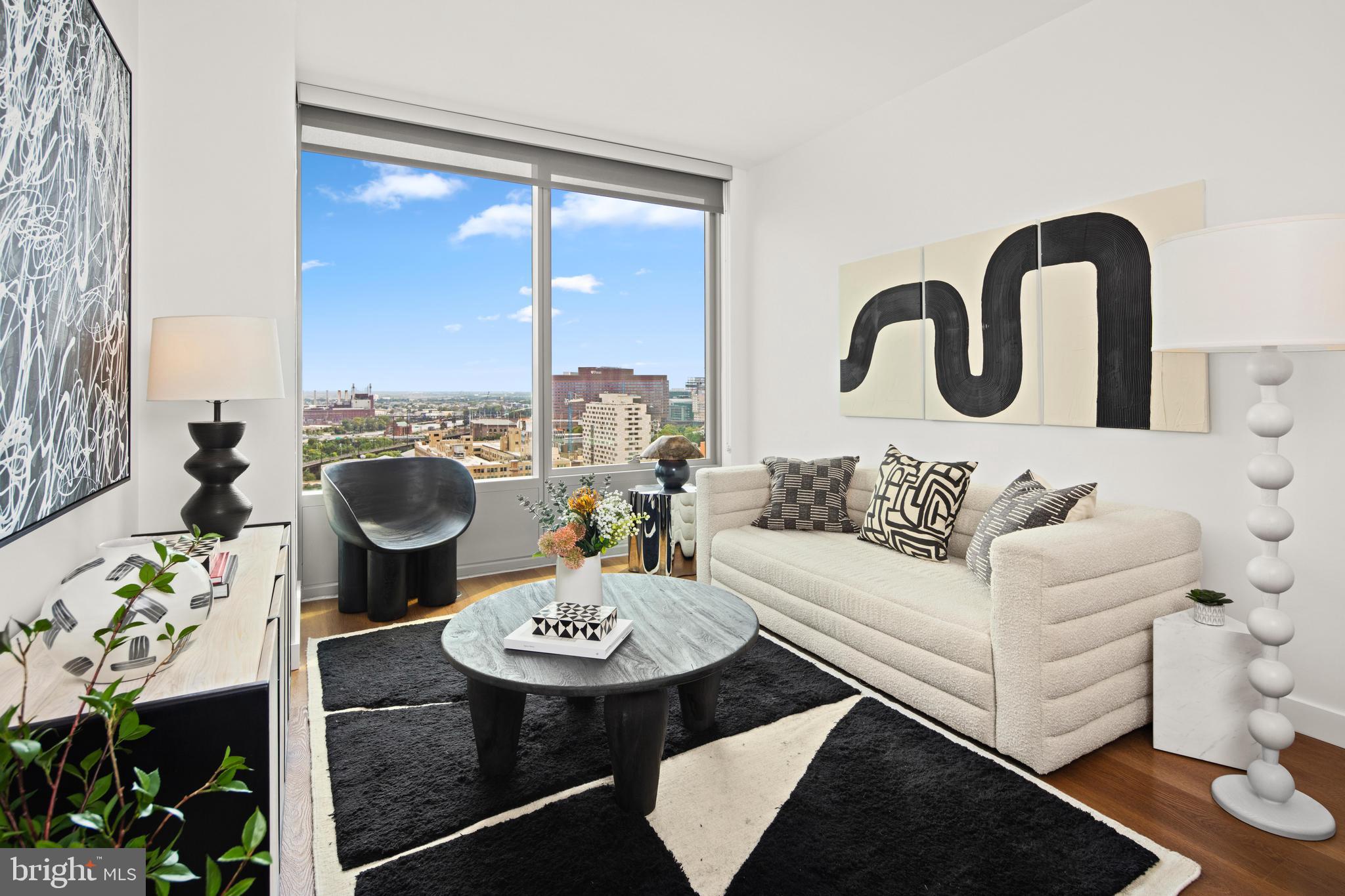 a living room with furniture and a table