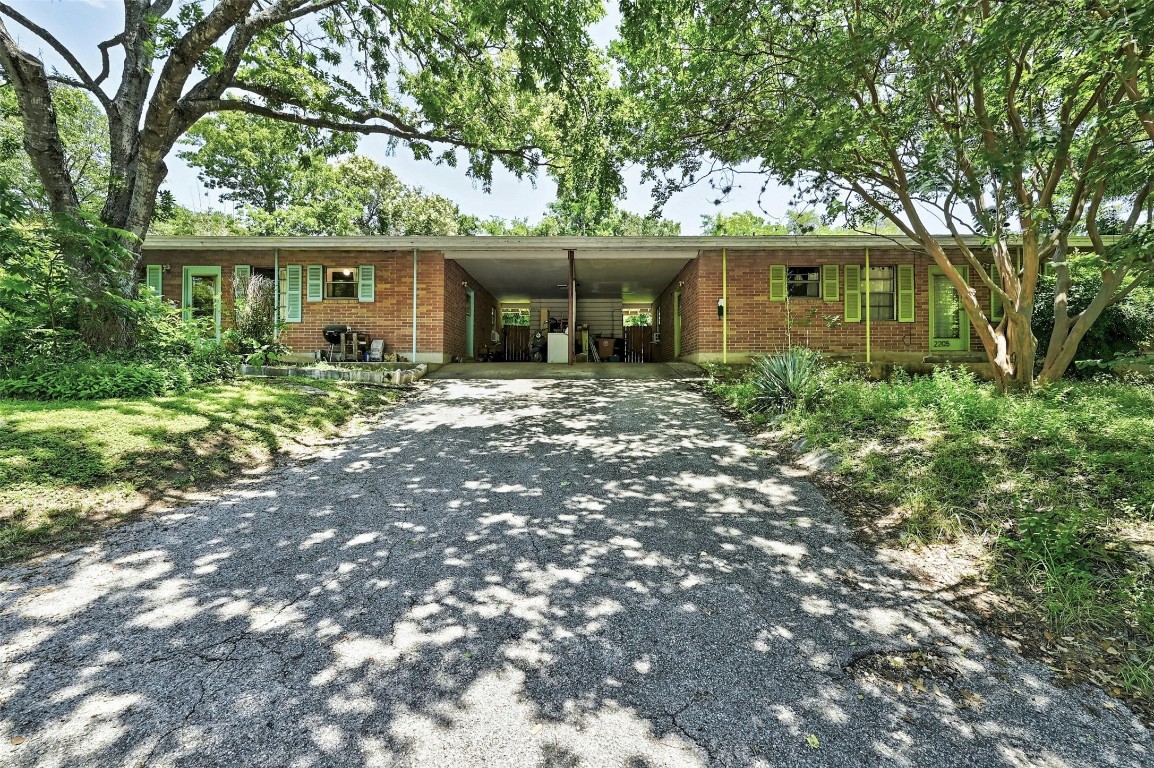 front view of a house with a tree