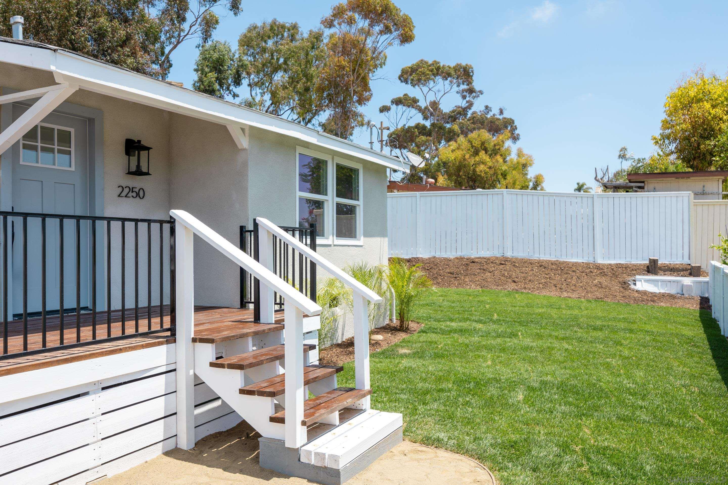 a view of backyard with deck