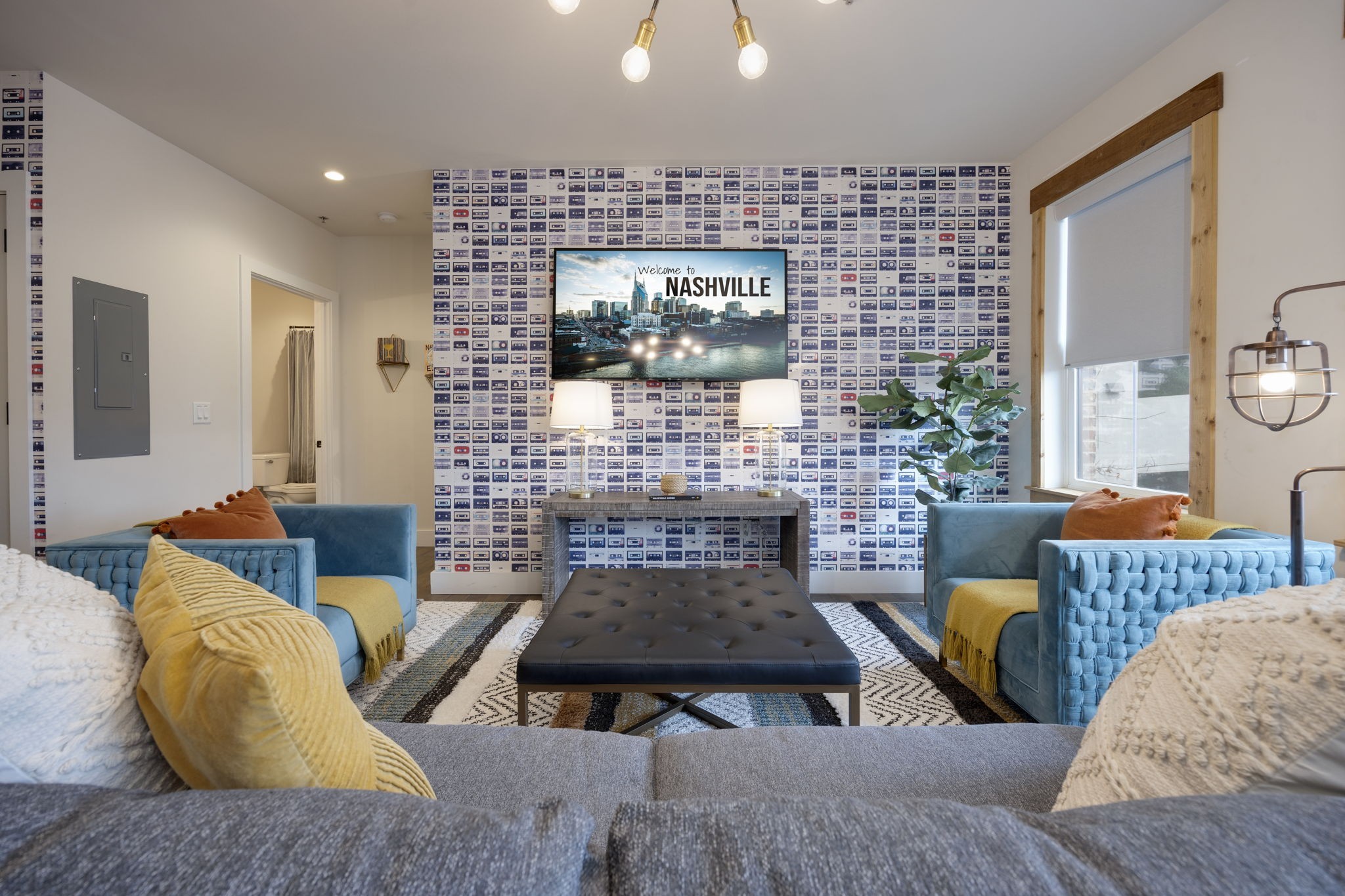 a living room with furniture and a fireplace