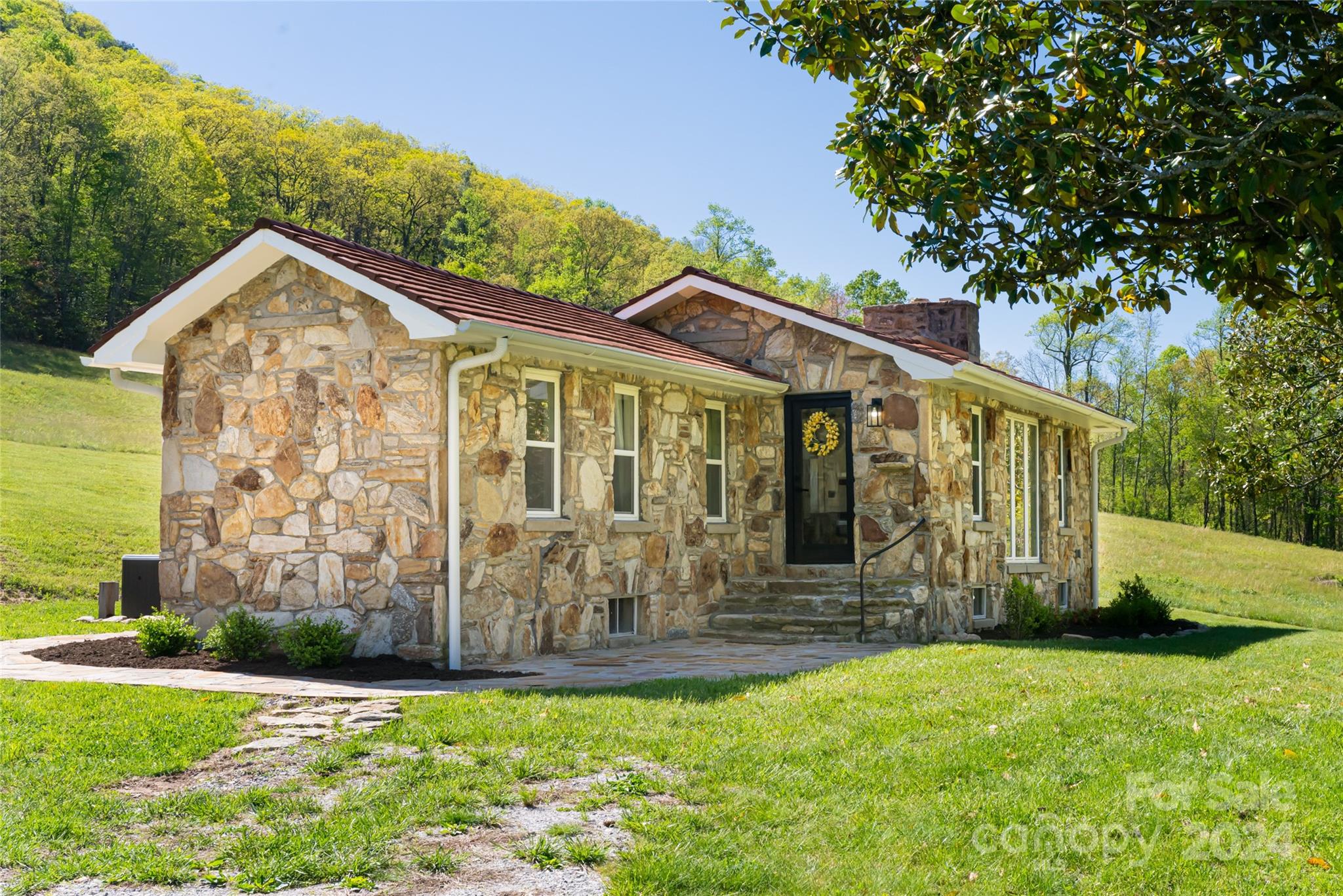 a front view of a house with garden