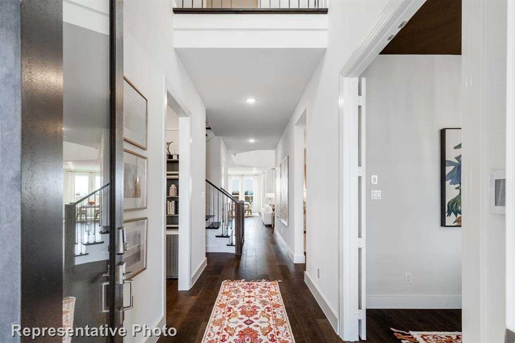 a view of a hallway with a chandelier