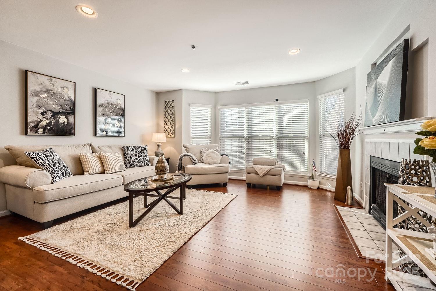 a living room with furniture or couch and a fireplace