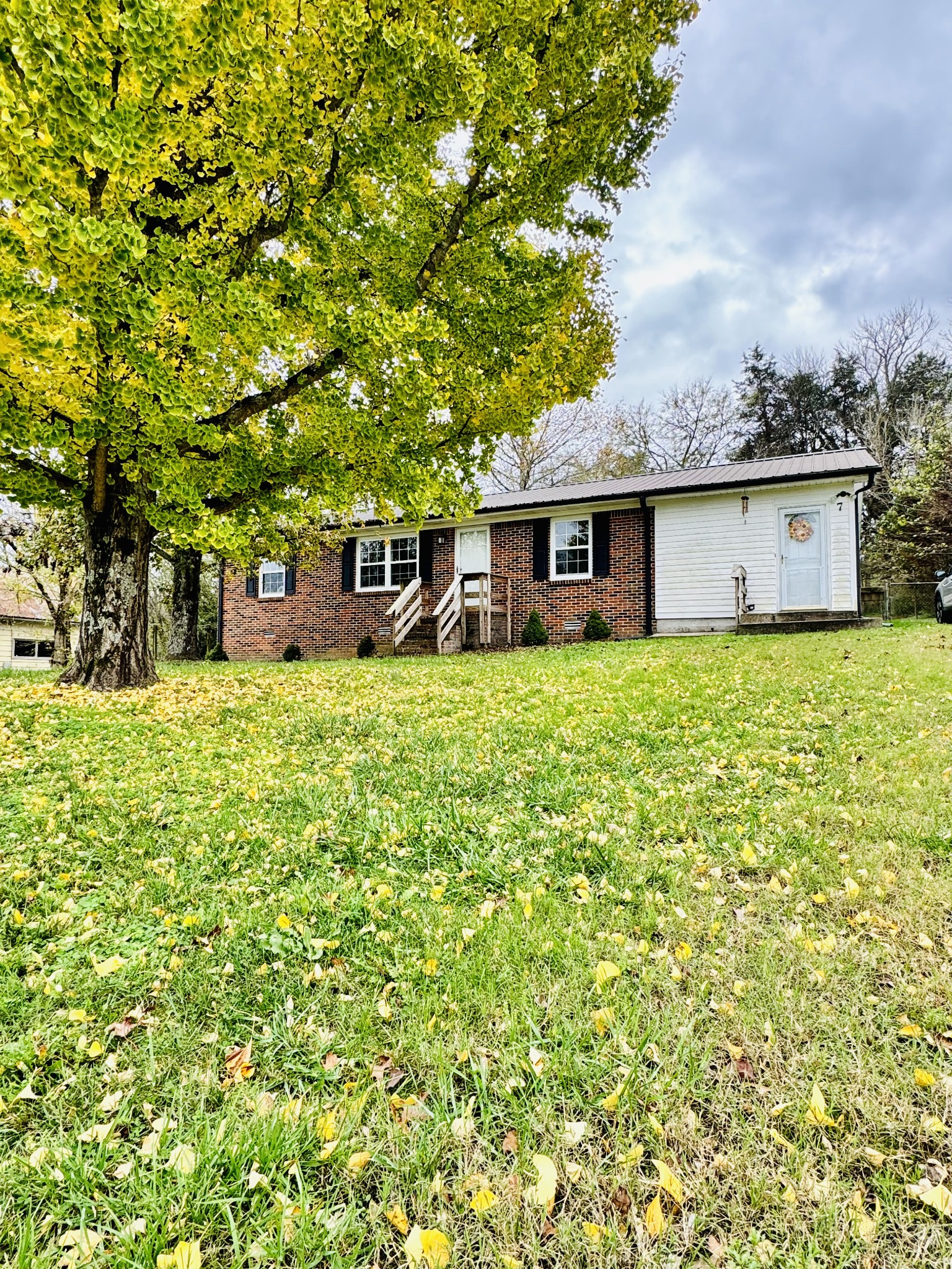 front view of a house with a yard