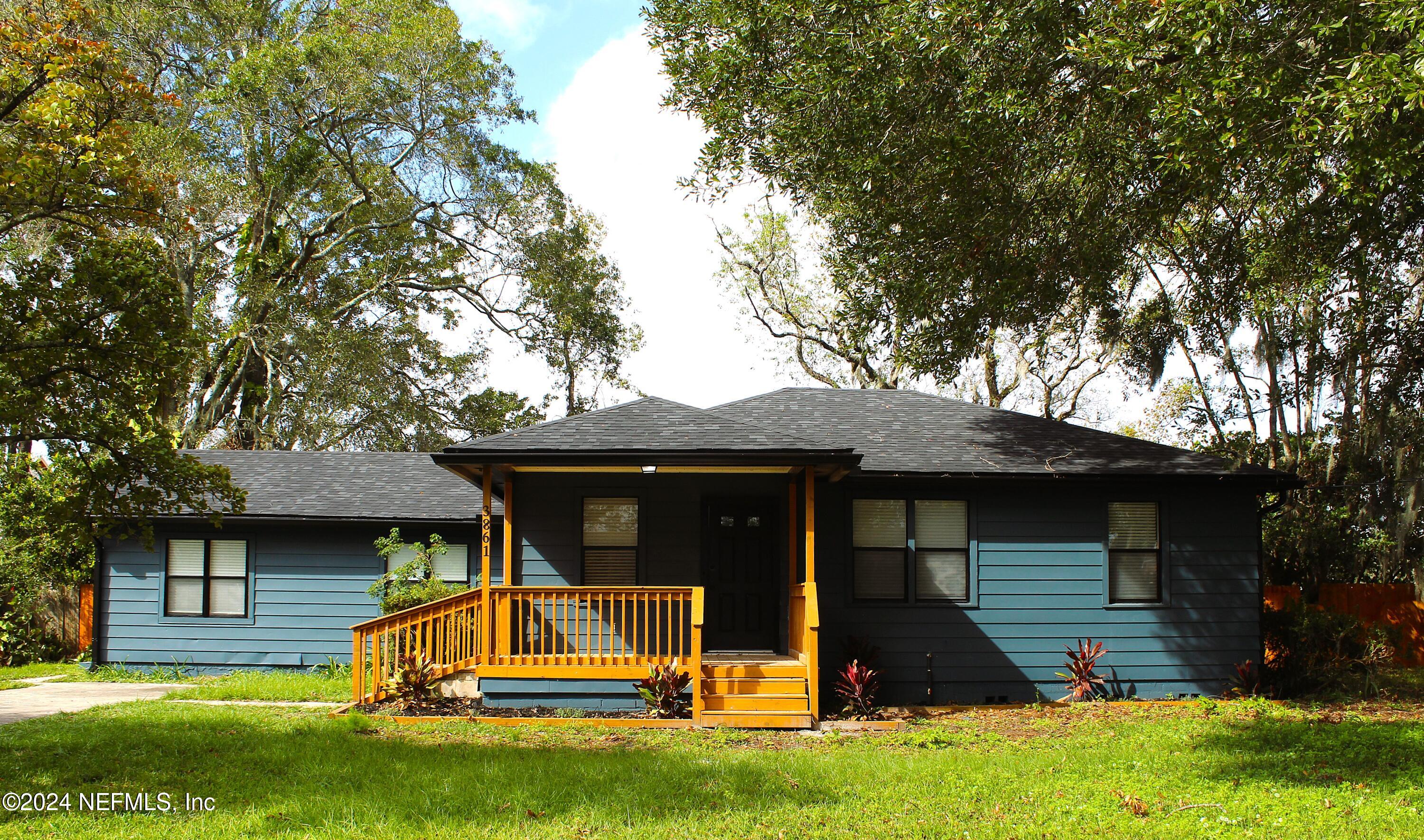 front view of a house with a yard